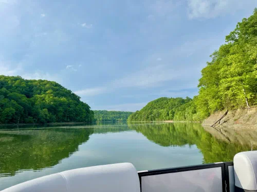 Sunshine and green hills from the bow of the boat